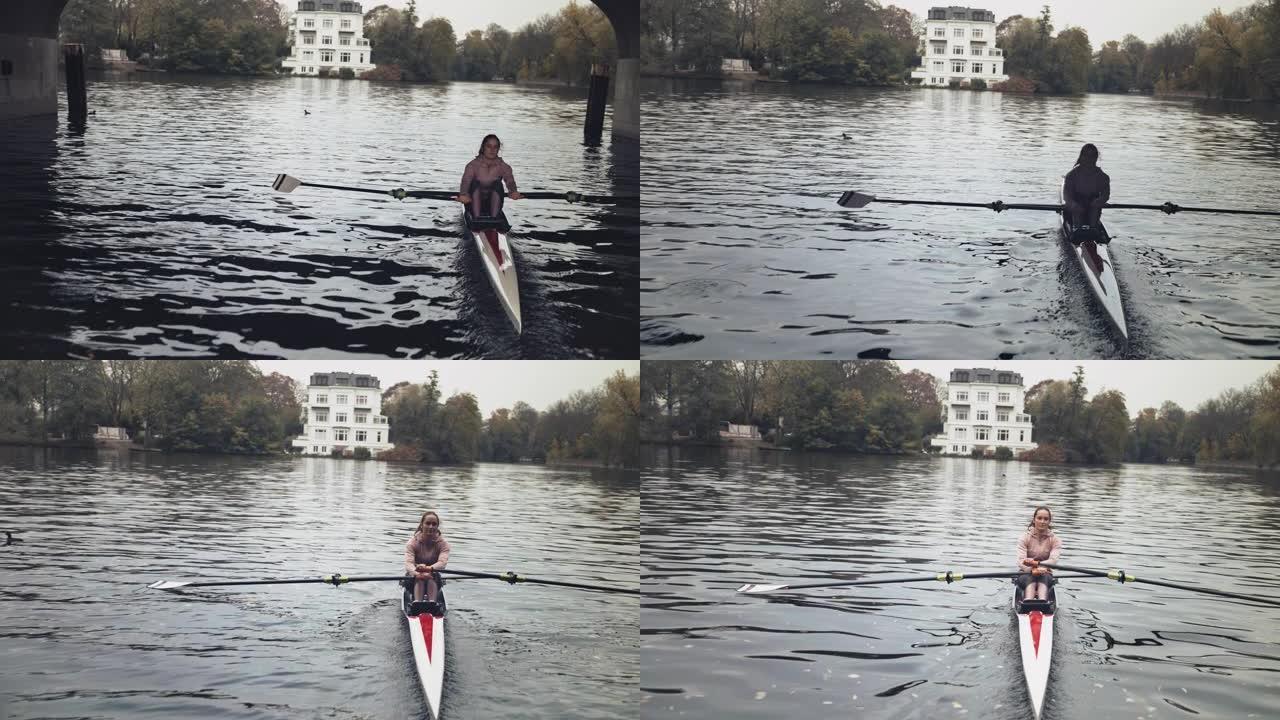 河里年轻的女性划桨划艇