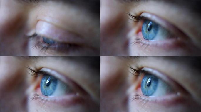 男性蓝眼睛的慢动作微距特写镜头在镜头外注视和眨眼