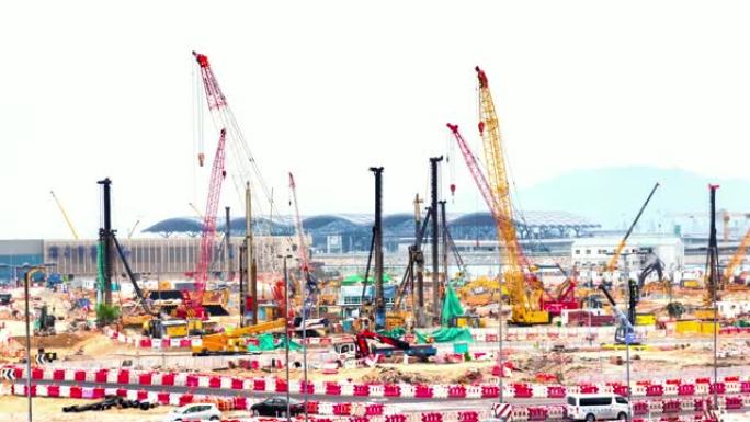 4k延时: 香港的建筑工地。许多起重机在工作的建筑工地。延时施工