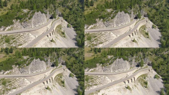无人机: 飞越意大利多洛米蒂的高架桥和山公路隧道。