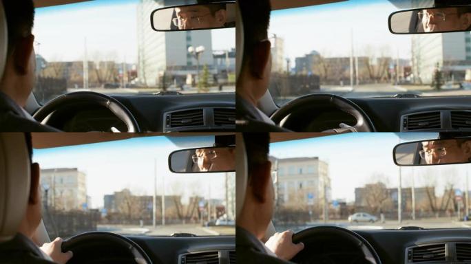 中年男子开车上班行驶过程车里摄像司机带人