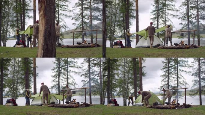 一群老年游客在森林中搭建露营帐篷