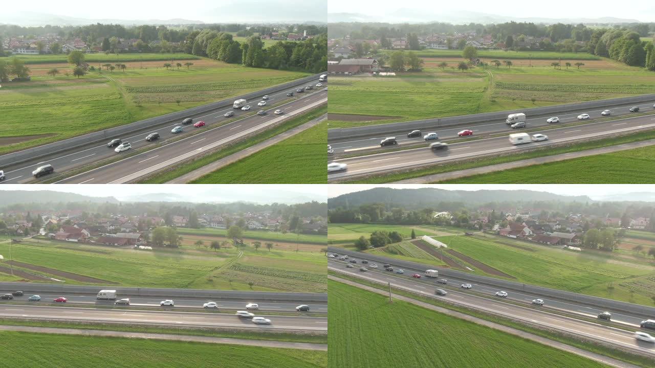 无人机: 汽车和卡车在繁忙的高速公路上缓慢驶过拥堵。
