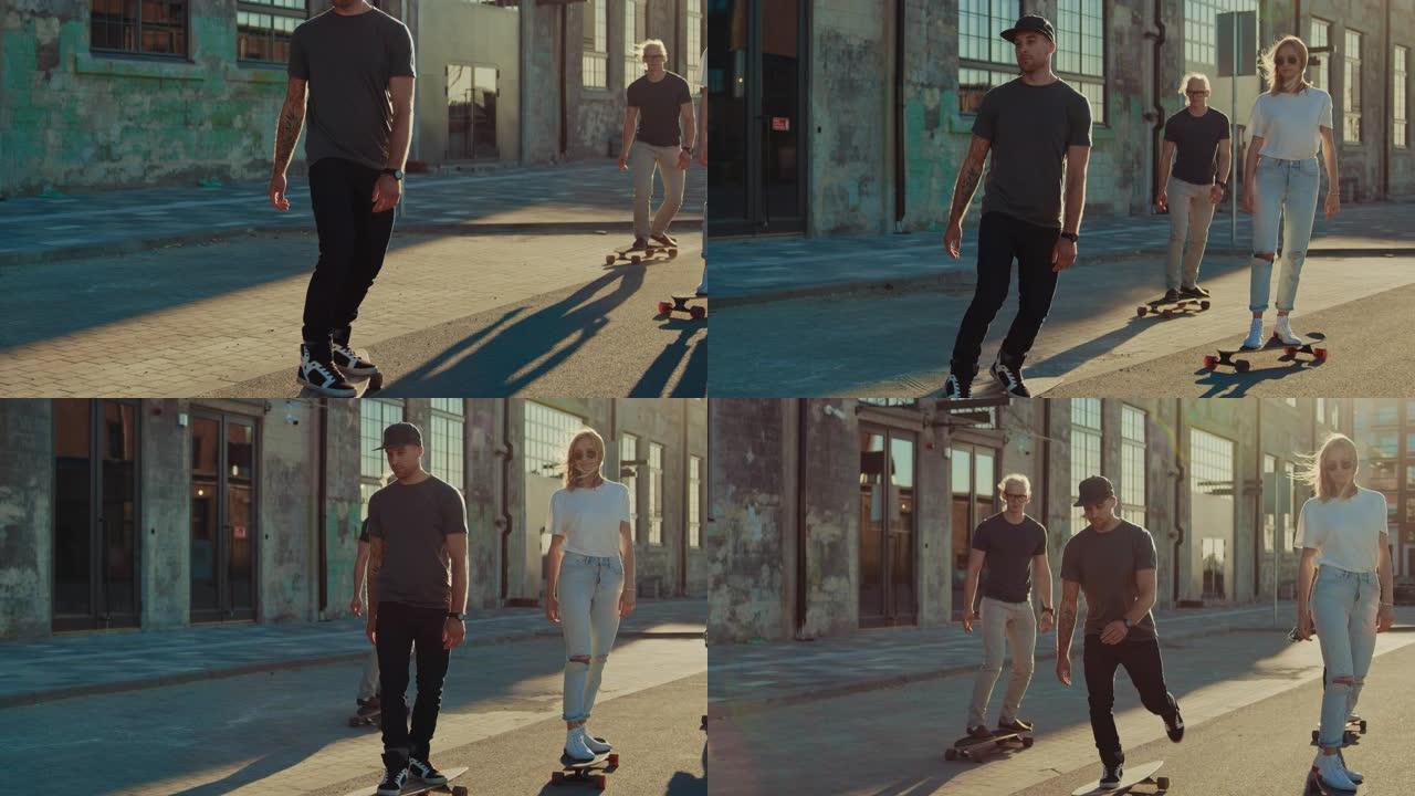 一群女孩和男孩在滑板上穿过时尚的潮人区。美丽的年轻人滑板穿过现代时尚的城市街道。移动慢动作人像相机拍