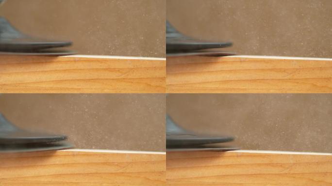 宏观: 粗砂纸精加工木工工件的详细镜头。