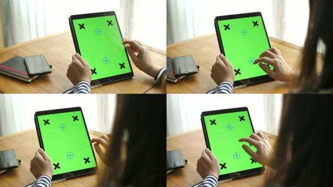 数字平板电脑上的女性绿色屏幕