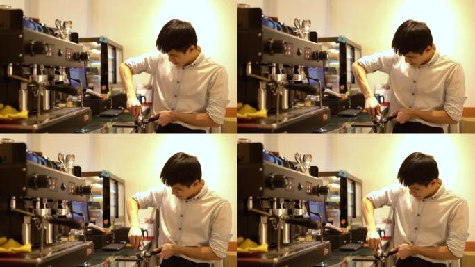 一个小企业主咖啡师在咖啡馆为他的顾客准备咖啡