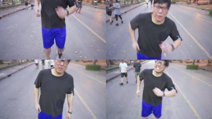 亚洲男子跑步时腿部疼痛的前视图