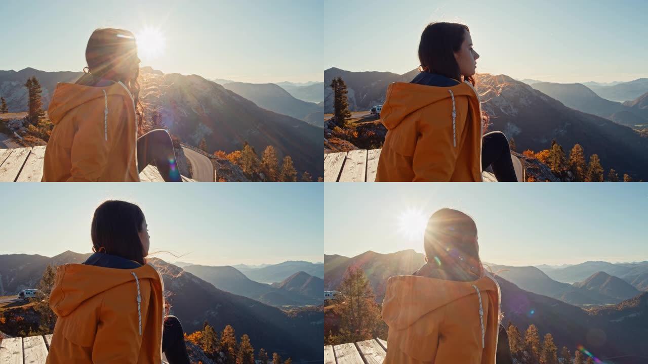 奥地利失败者山，宁静的年轻女子享受阳光明媚的山景