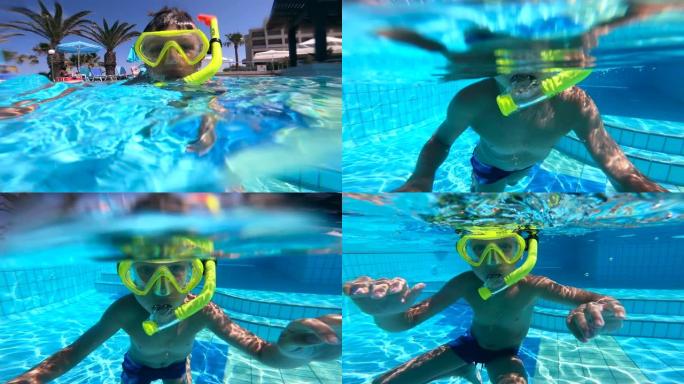一个戴着潜水面具的男孩正在浸入水中并从水中冒出来