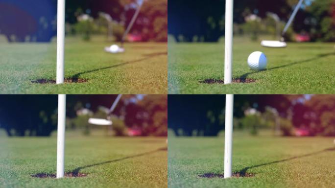 白球进入高尔夫球场的一个洞。