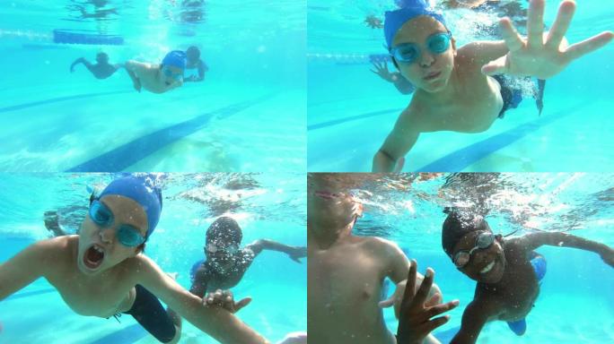 多民族男孩向挥舞着相机的方向游泳