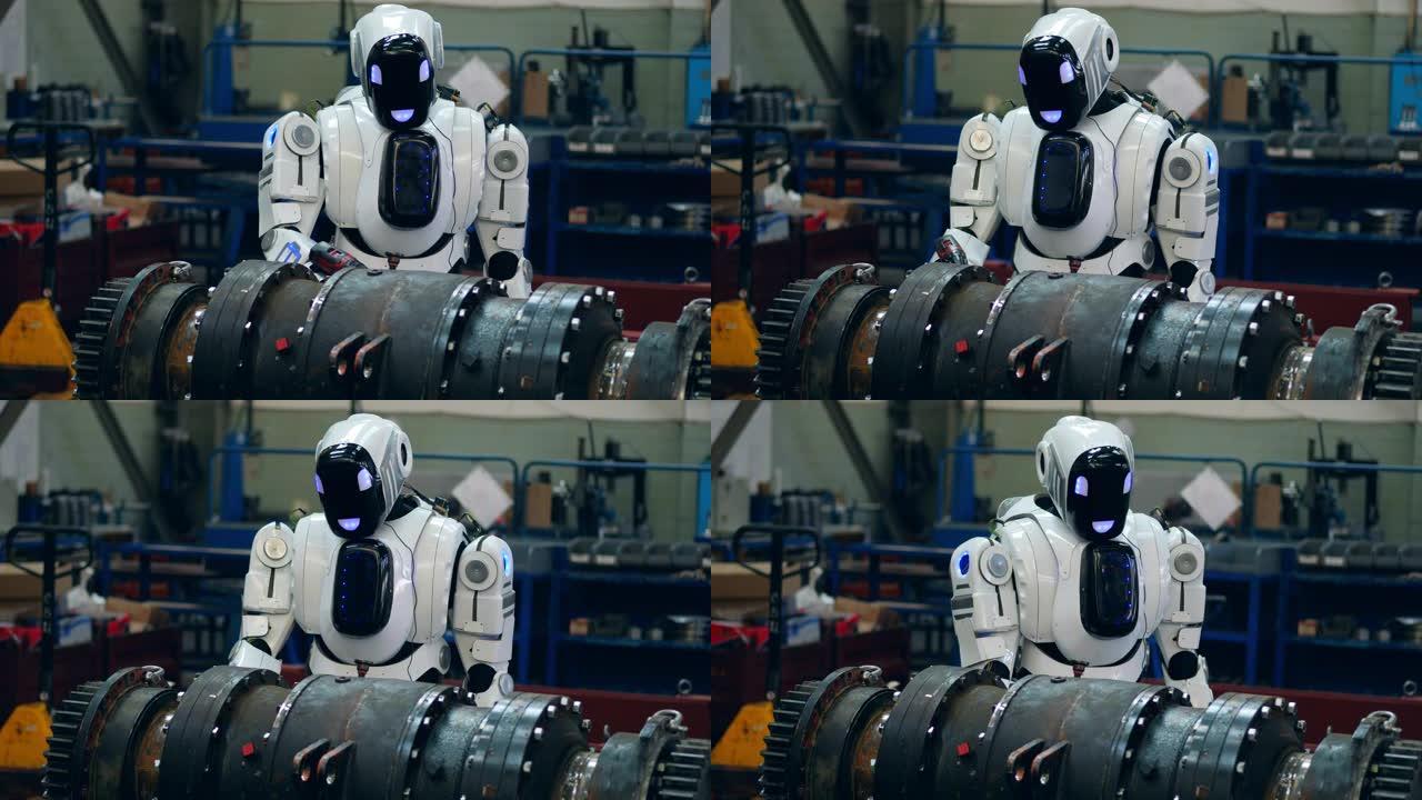 机器人在工厂拧紧金属细节。