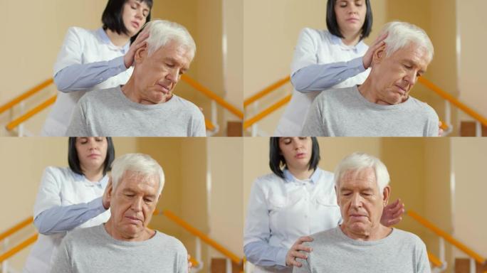 物理治疗师帮助脖子僵硬的老人