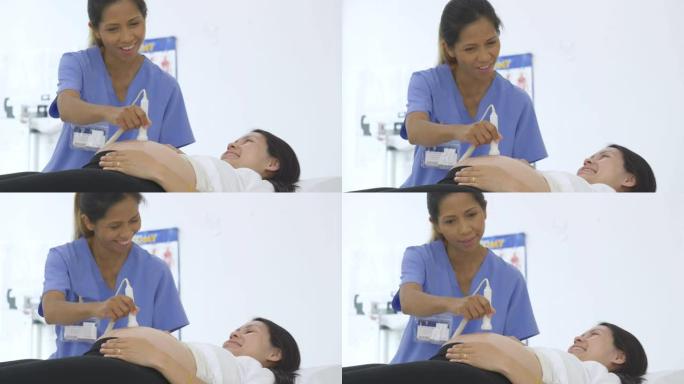 亚洲孕妇在医疗预约时接受超声波检查