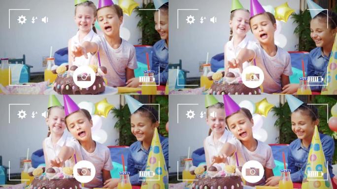 在数码相机上的生日聚会上给孩子们拍照