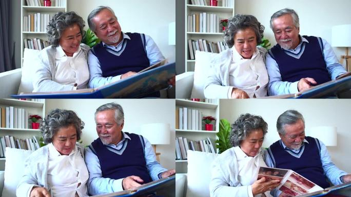 高级夫妇打开相册并记住幸福的时刻，成年父母欣赏家庭相册中的照片，记住青春。退休夫妇花时间看旧相册。