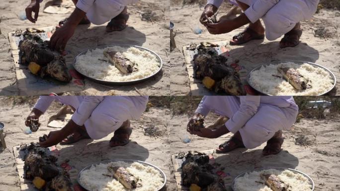 MS中东男子在沙漠中准备食物