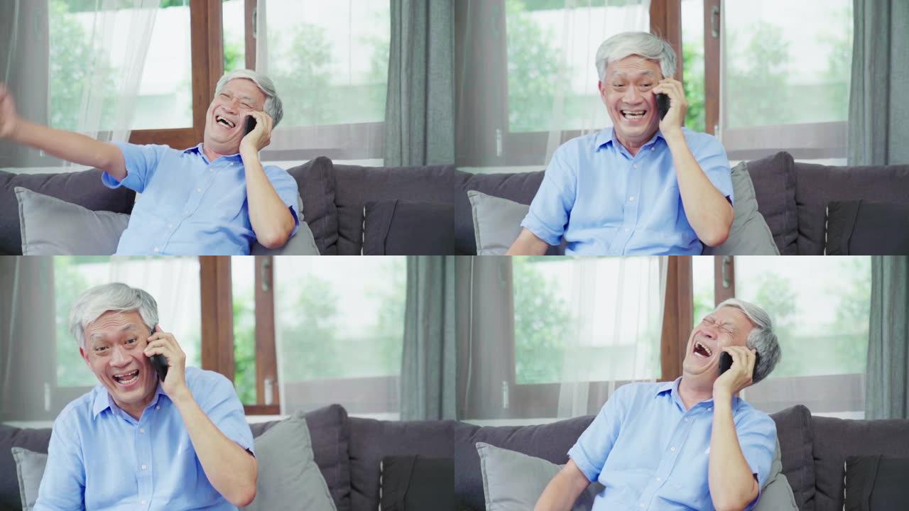 慢动作: 亚洲资深男子搞笑，用手机与人交谈。