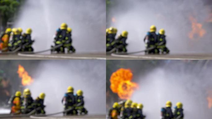 消防员使用消防水带灭火的4k后视图
