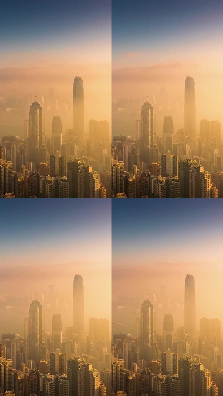 (垂直) 日出时香港摩天大楼和城市景观的延时。