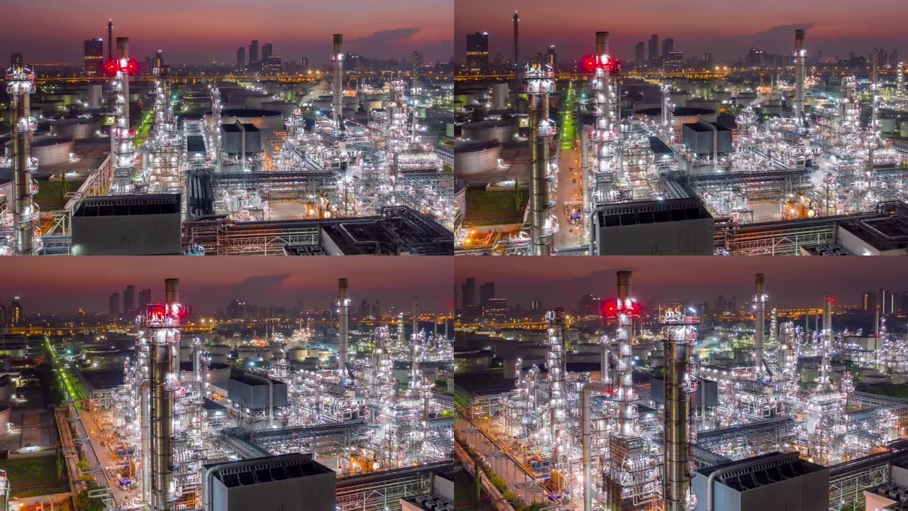 亚洲日出时带有炼油厂和储罐的工业园区的鸟瞰图，超脱或延时图