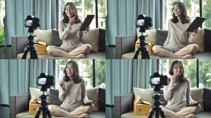 亚洲人在相机上说话，在家中的Vlog