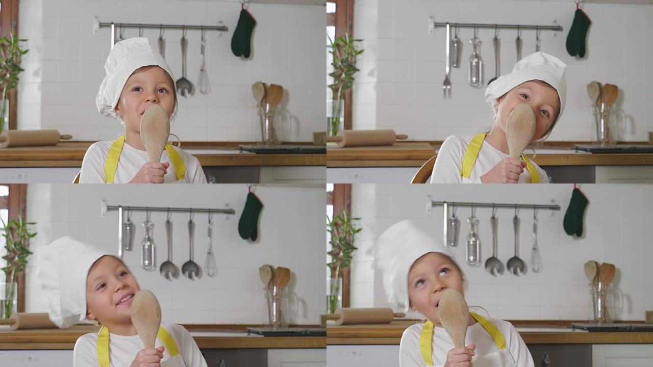 一个打扮成专业厨师的小女孩在厨房里用木勺作为麦克风唱歌。