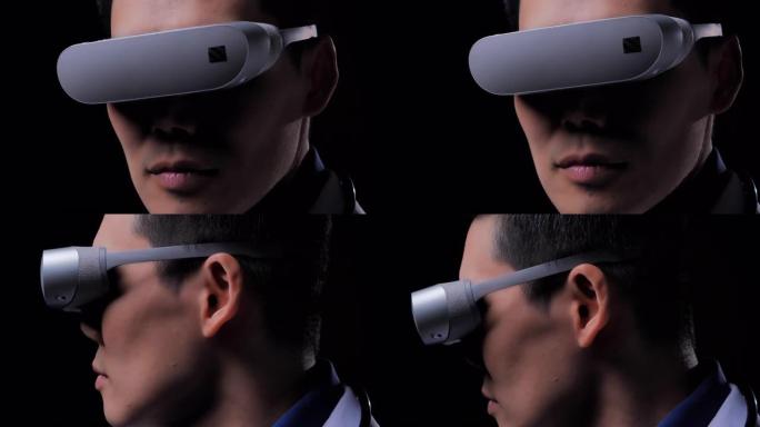 亚洲男性医生戴着虚拟现实眼镜，在黑色背景上寻找模拟器界面测试结果。成功，未来，技术，创新，医学，医院