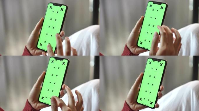 女人使用智能手机，绿屏，特写