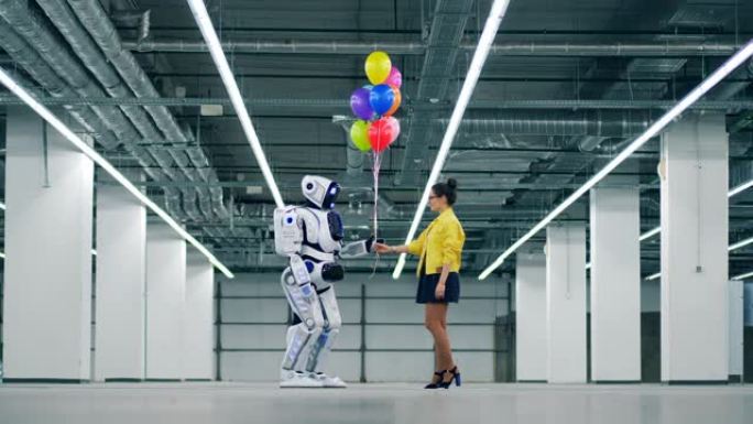 一个女人把一堆气球给一个白色机器人。