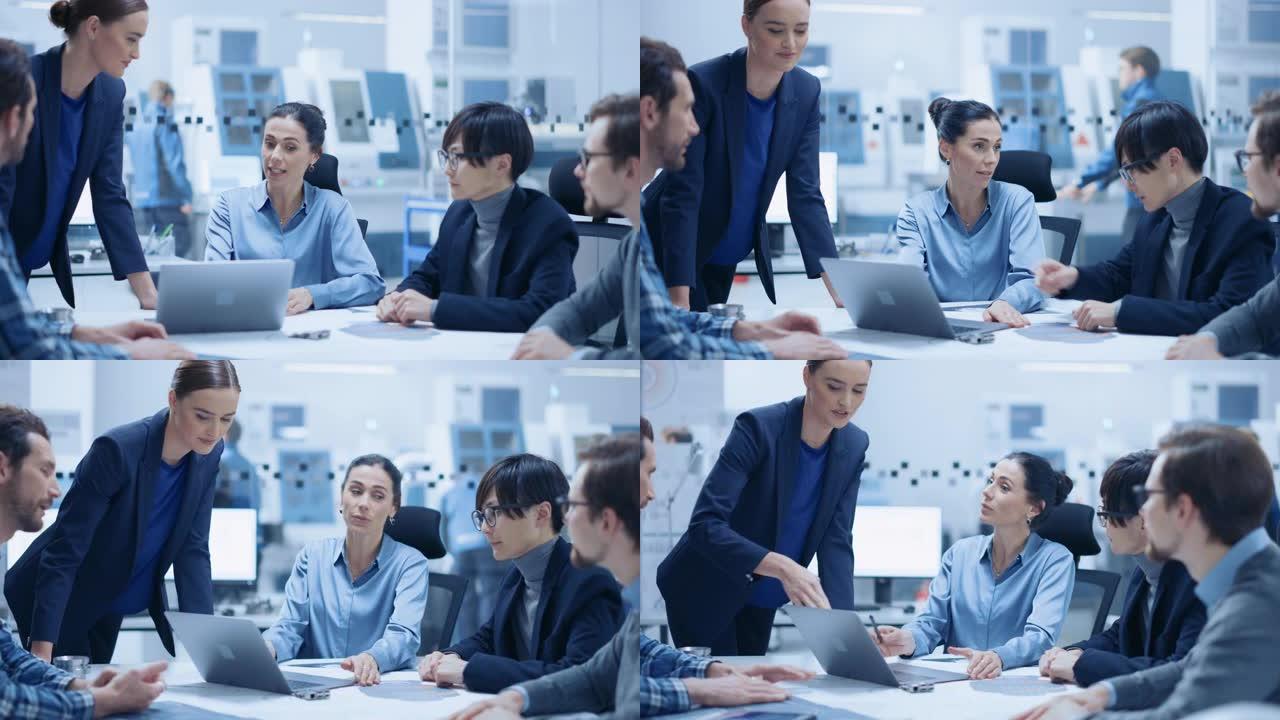 现代工厂办公室会议室: 自信的女项目经理与坐在会议上的工程师、商人和投资者组成的不同团队交谈。制造设