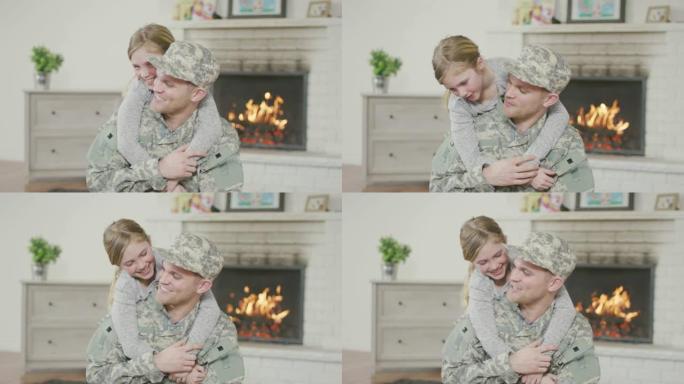 军人父亲拥抱他的小女儿