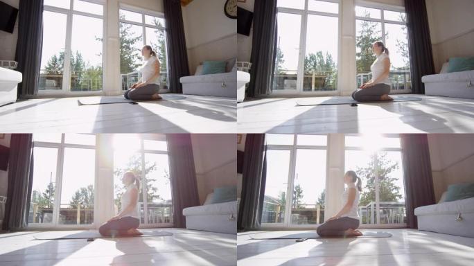 女人跪在瑜伽垫上冥想