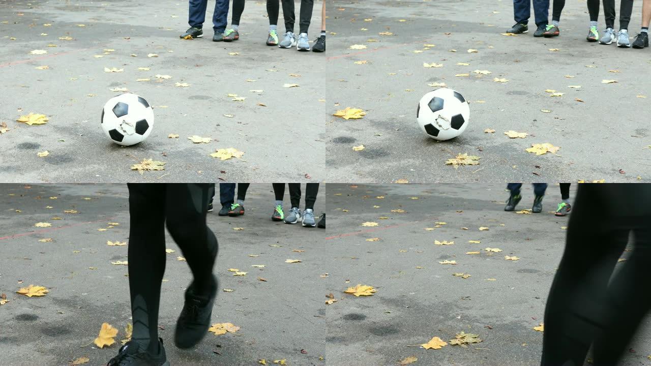 年轻的足球运动员在街上罚球