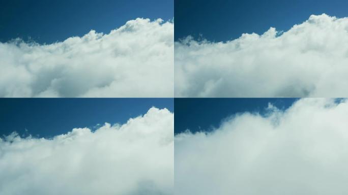 无人机视图在蓝天下穿越云层
