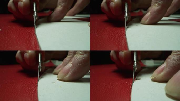 鞋匠的特写镜头是用皮革切割并制作一些女鞋的，他使用的是意大利的传统