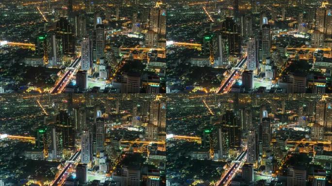 曼谷夜间高峰时段带交通交叉口和道路的建筑建筑的4k延时高架城市景观，带城市景观概念的交通