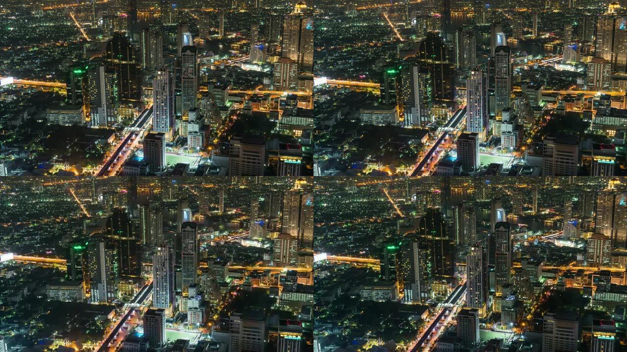 曼谷夜间高峰时段带交通交叉口和道路的建筑建筑的4k延时高架城市景观，带城市景观概念的交通