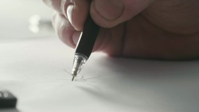 一个人的特写画一个投射在白纸上的新环设计。
