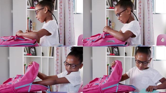 戴着眼镜的年轻女孩在家卧室里打包书包