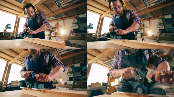 男性木匠在使用木材时使用工具。木匠在工作。