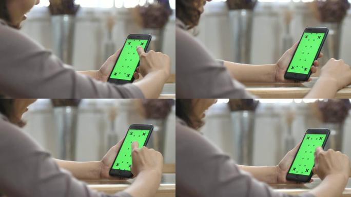 女人使用手机绿屏平板电脑绿幕绿屏触屏划屏