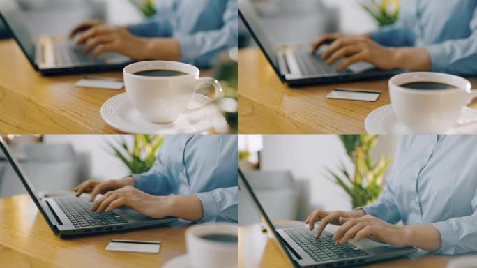 DS女人在笔记本电脑上工作时喝杯热咖啡