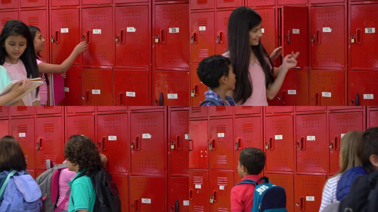 当小女孩将笔记本存放在学校的储物柜中时，学生走过