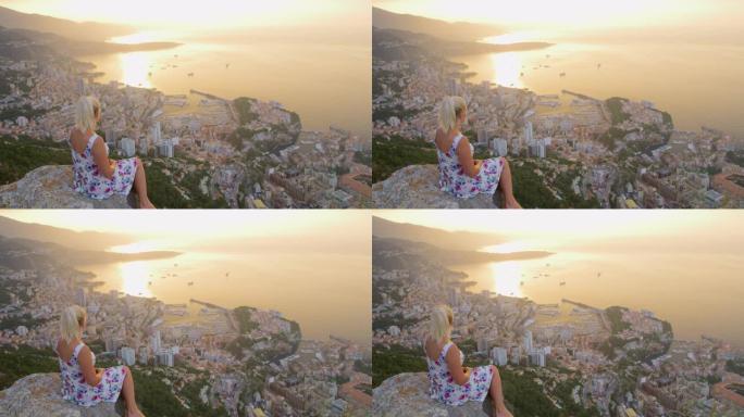 日落时欣赏摩纳哥景色的DS女人