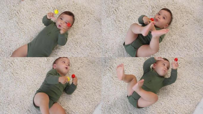 快乐的亚洲宝宝躺在地毯上玩耍