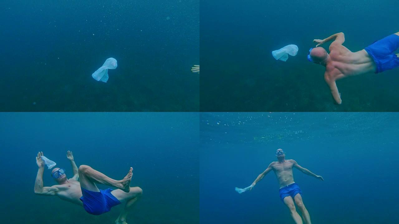 清洁海洋。男子在海面下抓塑料袋