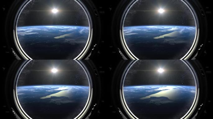 地球穿过宇宙飞船的大舷窗。窗户上的太阳。国际空间站正在绕地球运行。向右移动。现实的氛围。国际空间站。