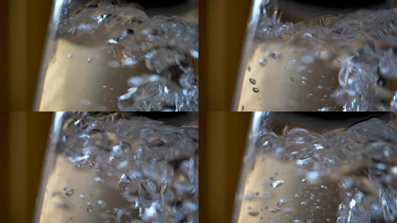 水壶沸腾。水壶中循环的水泡。慢动作特写镜头